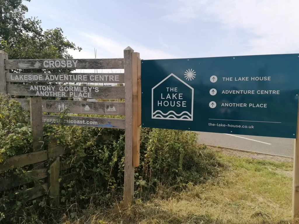 Sign for Crosby Lakeside Adventure Centre and The Lake House At Crosby Marina